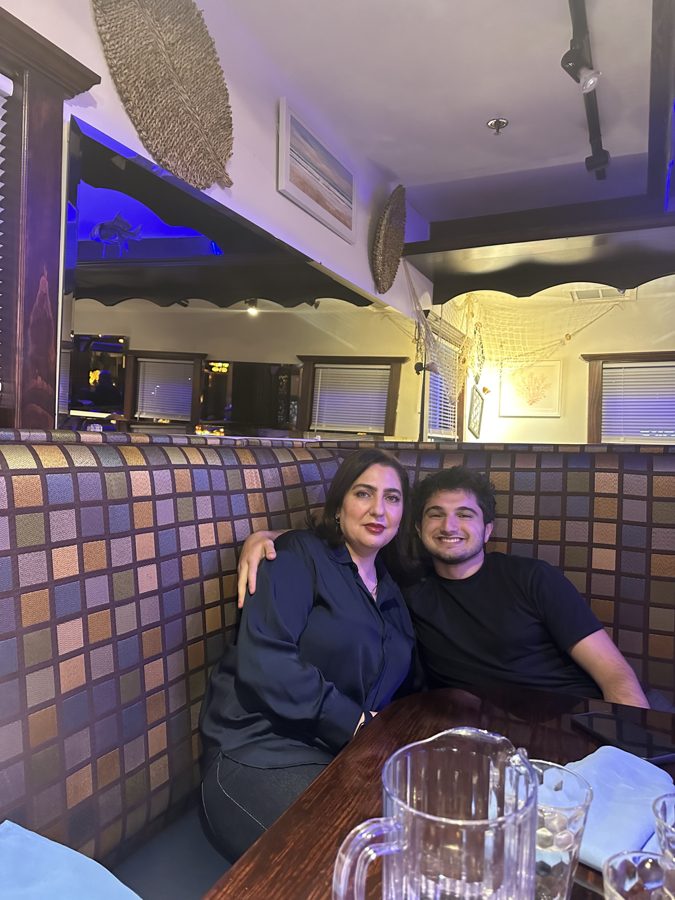 Abdul at dinner in a restaurant booth